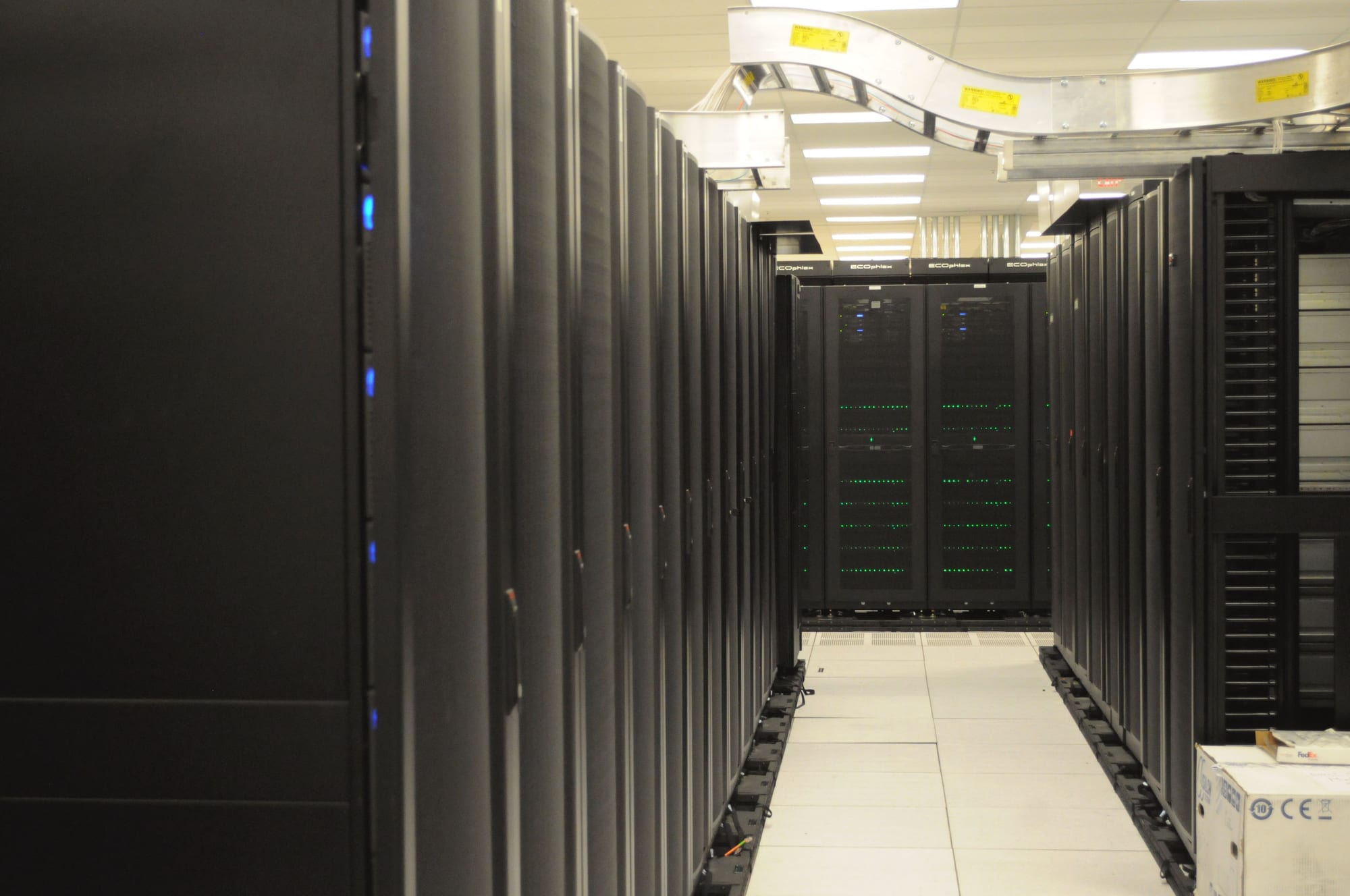 A corridor of server racks in a data center